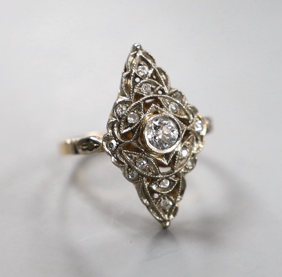 A 1950's Soviet 583 yellow metal (14k) and diamond set marquise cluster ring, size P/Q, gross weight 4.1 grams.